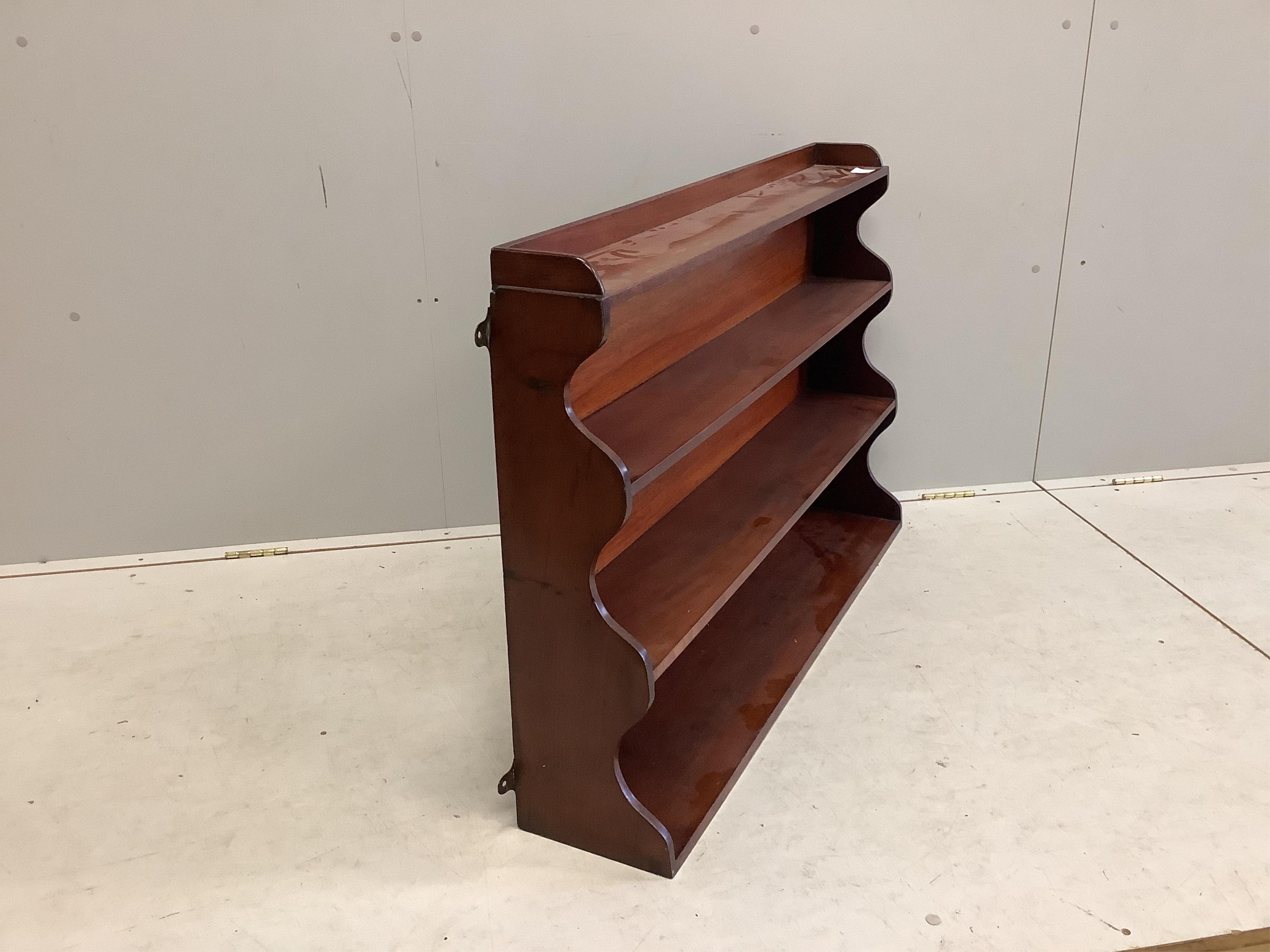 A Victorian mahogany four tier wall bracket, width 108cm, height 71cm. Condition - good